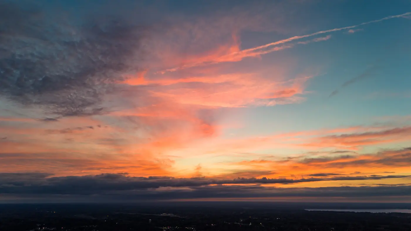 Aerial view of vivid pink and orange sunset clouds over Moncks Corner, SC